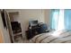 Bedroom with work space, comfortable bed, and large windows at 4215 E Bay Dr # 1506C, Clearwater, FL 33764