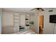 Bedroom showcasing custom closets and an adjacent bathroom at 4215 E Bay Dr # 1506C, Clearwater, FL 33764