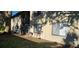 Rear view of condo unit with private patio and expansive lawn at 4215 E Bay Dr # 1506C, Clearwater, FL 33764