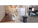 Well-lit kitchen next to dining area features ample counter space and essential appliances at 4215 E Bay Dr # 1506C, Clearwater, FL 33764