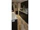 Modern kitchen with white countertops, dark cabinets, and stylish tile flooring at 4215 E Bay Dr # 1506C, Clearwater, FL 33764