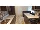 Updated kitchen with white countertops, dark cabinets, and modern appliances at 4215 E Bay Dr # 1506C, Clearwater, FL 33764