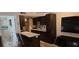Open concept kitchen and living room with updated appliances and fixtures at 4215 E Bay Dr # 1506C, Clearwater, FL 33764