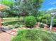 Lush backyard featuring mature trees, verdant landscaping, and a charming picket fence at 4306 Woodside Manor Dr, Tampa, FL 33624