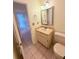 Bathroom featuring a single sink vanity with a toilet and tiled floor at 4306 Woodside Manor Dr, Tampa, FL 33624