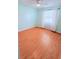 Bedroom with hardwood flooring, ceiling fan, and neutral paint at 4306 Woodside Manor Dr, Tampa, FL 33624