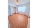 Bedroom with hardwood flooring, closet, and neutral paint at 4306 Woodside Manor Dr, Tampa, FL 33624