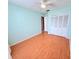 Bedroom with hardwood flooring, closet, and neutral paint at 4306 Woodside Manor Dr, Tampa, FL 33624