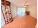 Bright dining room featuring hardwood floors, a large glass cabinet, and backyard access at 4306 Woodside Manor Dr, Tampa, FL 33624