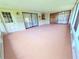 Screened lanai with a concrete floor and access to the backyard at 4306 Woodside Manor Dr, Tampa, FL 33624