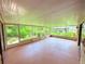 Large screened lanai with views of the landscaped backyard and pool at 4306 Woodside Manor Dr, Tampa, FL 33624