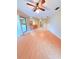 Bright and airy living room with hardwood floors and sliding door access to the patio at 4306 Woodside Manor Dr, Tampa, FL 33624