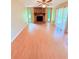 Cozy living room with a stone fireplace and a ceiling fan at 4306 Woodside Manor Dr, Tampa, FL 33624