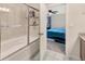 View from the bathroom doorway, showing the bathtub, shower, and part of the main bedroom at 4703 Somerset Hill Ln, Riverview, FL 33578