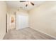 Bedroom features plush carpeting, closet and hallway access at 4760 Wheel House Dr, New Port Richey, FL 34652