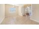 The dining room boasts tiled floors, a large window, and an arched entryway with decorative columns at 4760 Wheel House Dr, New Port Richey, FL 34652