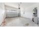 Spacious two-car garage, featuring an automatic door, utility sink, and water heater at 4760 Wheel House Dr, New Port Richey, FL 34652