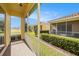 Screened lanai overlooking lawn, offering peaceful outdoor living and neighbor views at 4760 Wheel House Dr, New Port Richey, FL 34652