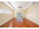 Bright living room features hardwood floors, ceiling fan and sliding glass doors at 4760 Wheel House Dr, New Port Richey, FL 34652