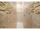 Walk-in shower featuring tile surround, mosaic accents and modern shower head at 4760 Wheel House Dr, New Port Richey, FL 34652