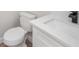 Modern bathroom featuring a vanity with a quartz countertop and a toilet at 513 Sportsman Park Dr, Seffner, FL 33584
