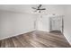 Bright bedroom features luxury floors, a ceiling fan, large windows and neutral paint at 513 Sportsman Park Dr, Seffner, FL 33584