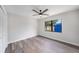 Bright bedroom features luxury floors, a ceiling fan, and large window at 513 Sportsman Park Dr, Seffner, FL 33584