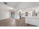 Modern kitchen features stainless steel appliances, quartz countertops, and sliding door view of the pool at 513 Sportsman Park Dr, Seffner, FL 33584