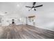 Bright and airy living space featuring hardwood floors, vaulted ceilings, and bar area at 513 Sportsman Park Dr, Seffner, FL 33584