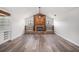 Inviting living room featuring vaulted ceilings, a brick fireplace, shelving, and modern light fixtures at 513 Sportsman Park Dr, Seffner, FL 33584