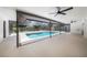 Backyard screened pool area with ceiling fans, recessed lighting, and space for outdoor entertaining at 513 Sportsman Park Dr, Seffner, FL 33584