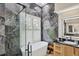 A modern bathroom with a soaking tub, a glass shower, and decorative tile wall at 5217 88Th E St, Bradenton, FL 34211