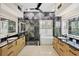 Elegant bathroom featuring a soaking tub, glass shower, double vanities and stylish marble and tile work at 5217 88Th E St, Bradenton, FL 34211