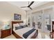 Bright bedroom with neutral walls, a ceiling fan, and French doors that lead to the outdoor patio at 5217 88Th E St, Bradenton, FL 34211