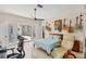 Comfortable bedroom featuring French doors to the backyard, a ceiling fan, and guitar decorations at 5217 88Th E St, Bradenton, FL 34211