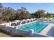 Enjoy a large community pool with ample lounge seating, umbrellas, and manicured landscaping at 5217 88Th E St, Bradenton, FL 34211