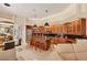Spacious kitchen with dark granite island, seating, modern appliances, and open layout to the living space at 5217 88Th E St, Bradenton, FL 34211