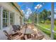 Relaxing screened lanai features comfortable seating and an outdoor grill, perfect for enjoying the weather at 5217 88Th E St, Bradenton, FL 34211