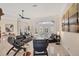 Spacious living room with tile floors, modern furniture and a view of the pool at 5217 88Th E St, Bradenton, FL 34211