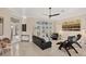 Spacious living room with tile floors, modern furniture and a ceiling fan at 5217 88Th E St, Bradenton, FL 34211
