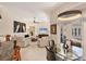 Open living area featuring a glass table, modern ceiling fan, neutral decor, and plenty of natural light at 5217 88Th E St, Bradenton, FL 34211