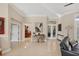 Open-concept living area with tile floors, view of the kitchen and access to outdoor living at 5217 88Th E St, Bradenton, FL 34211