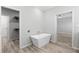 Bathroom with modern soaking tub and access to a large closet at 6924 Americana Ne Dr # 167, St Petersburg, FL 33702