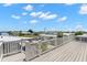 Deck view of canal community with white railing and light-colored deck at 6924 Americana Ne Dr # 167, St Petersburg, FL 33702