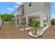 Home exterior with undercarriage, lift, and manicured landscaping at 6924 Americana Ne Dr # 167, St Petersburg, FL 33702