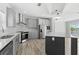 Eat-in kitchen with stainless appliances, hard surface countertops, gray cabinets, and an island at 6924 Americana Ne Dr # 167, St Petersburg, FL 33702