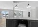 Open floor plan showcasing kitchen island, recessed lighting, and sliding doors to a water view balcony at 6924 Americana Ne Dr # 167, St Petersburg, FL 33702