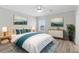 Relaxing main bedroom features a ceiling fan, recessed lights, and modern decor at 6924 Americana Ne Dr # 167, St Petersburg, FL 33702