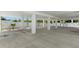 Spacious undercarriage with landscaping along the white perimeter fencing at 6924 Americana Ne Dr # 167, St Petersburg, FL 33702
