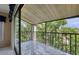 Tiled balcony overlooking lush greenery, with access from sliding glass doors at 700 Starkey Rd # 1145, Largo, FL 33771